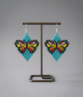 Boucles d'oreilles papillon perlées (turquoise)