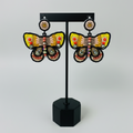 Boucles d'oreilles papillon perlées - Jaune et orange