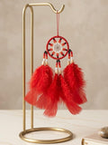 Petit attrape-rêves rouge fait main avec plumes rouges