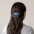 Barrette à perles papillon bleu clair