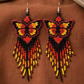 Boucles d'oreilles ailes dansantes perlées noires