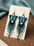 Boucles d'oreilles ailes dansantes en perles bleues