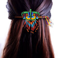Barrette en perles papillon en bâtonnets de bois rouges et verts avec franges