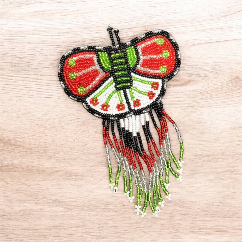 Barrettes perlées papillon avec franges rouges et vertes