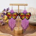 Boucles d'oreilles ailes dansantes perlées violet clair