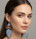 Boucles d'oreilles ailes dansantes perlées bleues