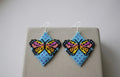 Boucles d'oreilles papillon perlées (bleues)