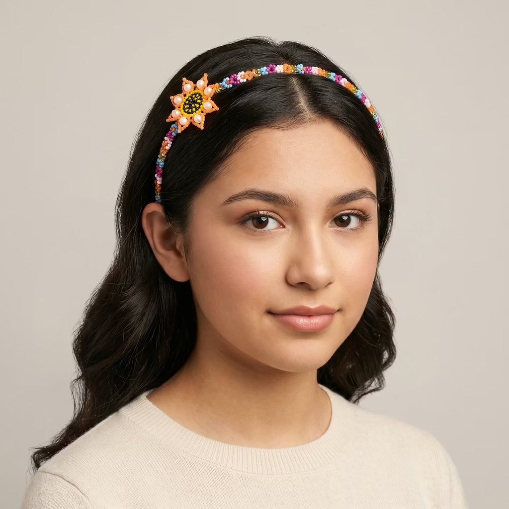 Bandeau perlé avec fleur orange