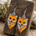 Boucles d'oreilles renard perlées (grises)