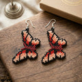 Boucles d'oreilles papillon rouges perlées