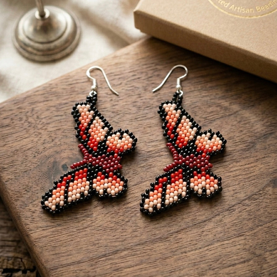Boucles d'oreilles papillon rouges perlées