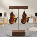 Boucles d'oreilles ailes de papillon perlées marron