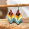 OldTribes. Boucles d'oreilles pendantes Plumes et Perles Turquoises