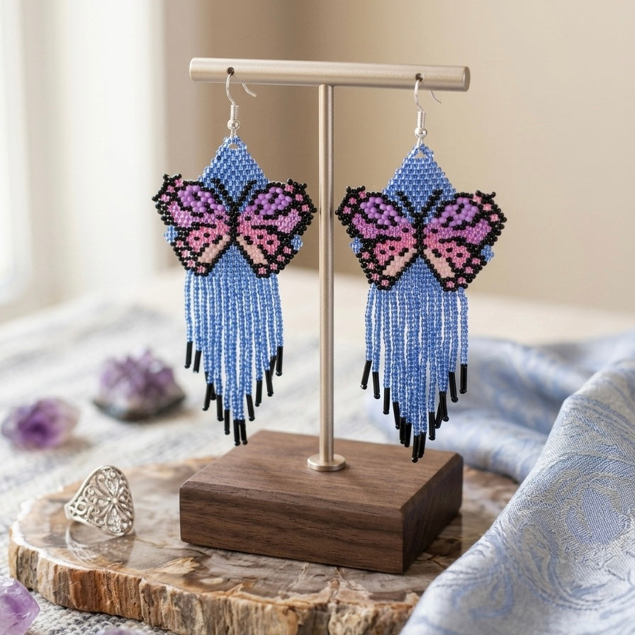 Boucles d'oreilles ailes dansantes en perles bleues