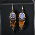 Boucles d'oreilles pendantes rondes orange et bleues de style sud-ouest