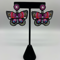 Boucles d'oreilles papillon perlées – Noir et rose