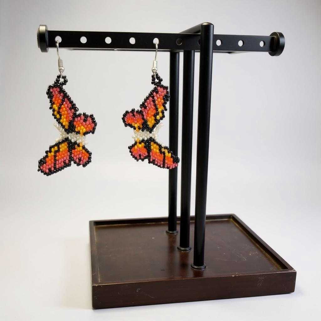 Boucles d'oreilles papillon perlé blanc et noir