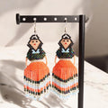 Boucles d'oreilles de danseuse jupe ruban perlées bleu orange