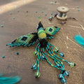 Barrette colibri noire avec franges