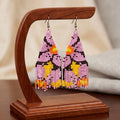 Boucles d'oreilles pendantes perlées à fleurs (violettes)