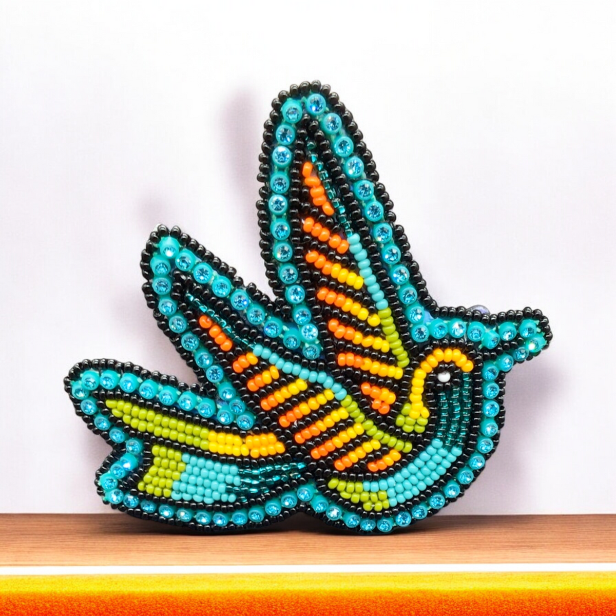Barrette colibri perlée turquoise et orange