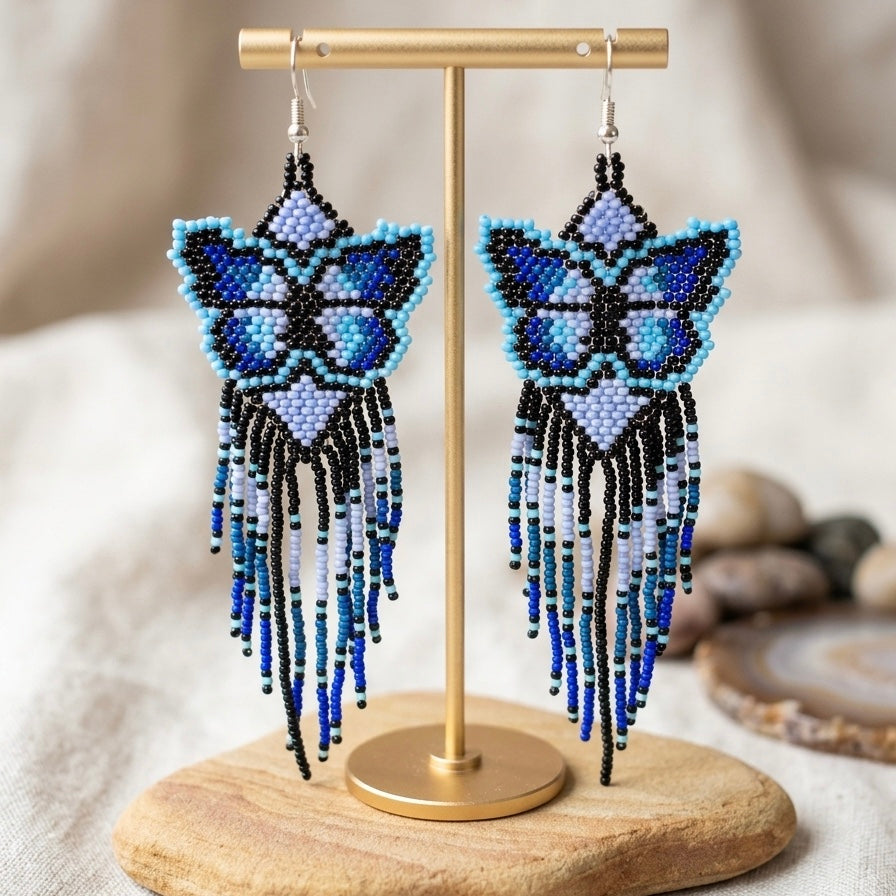 Boucles d'oreilles ailes dansantes en perles bleues
