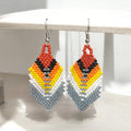 Boucles d'oreilles pendantes à plumes et perles grises OldTribes™