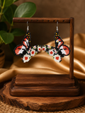 Boucles d'oreilles papillon dansant perlées bleu clair