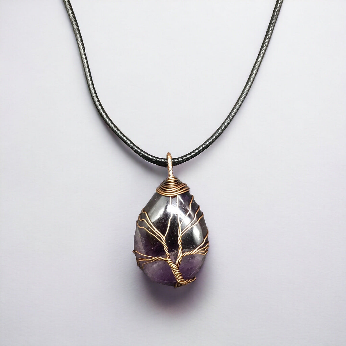 Pendentif pierre précieuse violette, arbre de vie cuivré