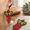 Boucles d'oreilles ailes de danse perlées rouge foncé
