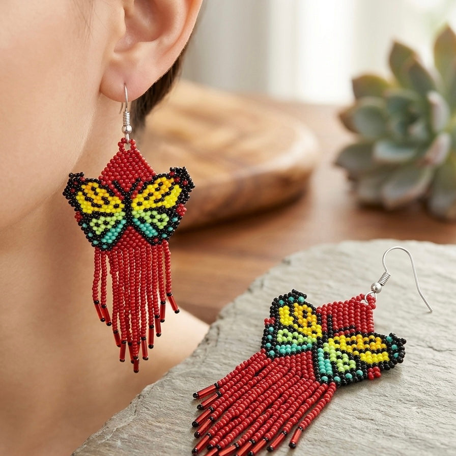 Boucles d'oreilles ailes de danse perlées rouge foncé