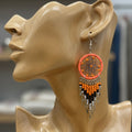 Boucles d'oreilles pendantes attrape-rêves orange et noires