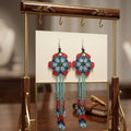 Boucles d'oreilles perlées Sun Feather Bloom - noir/turquoise