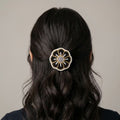Barrette fleur perlée dorée