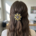 Barrette à fleurs perlée dorée