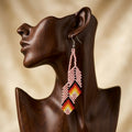 Boucles d'oreilles OldTribes™ en perles roses et plumes
