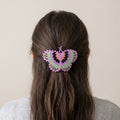 Barrette perlée papillon rose