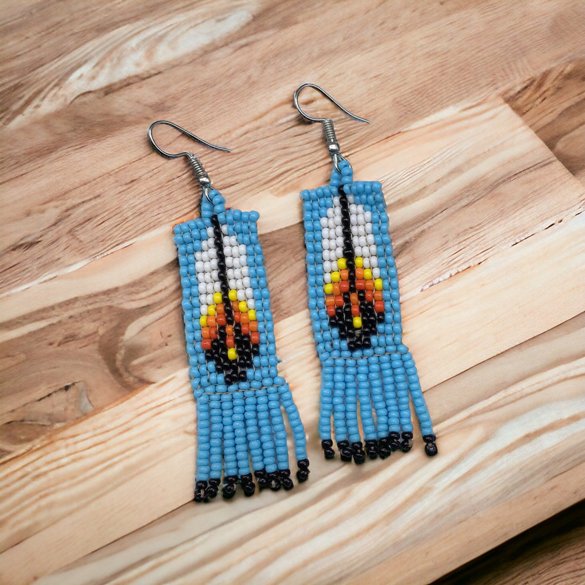 Boucles d'oreilles Oldtribes™ plume perlée bleu ciel