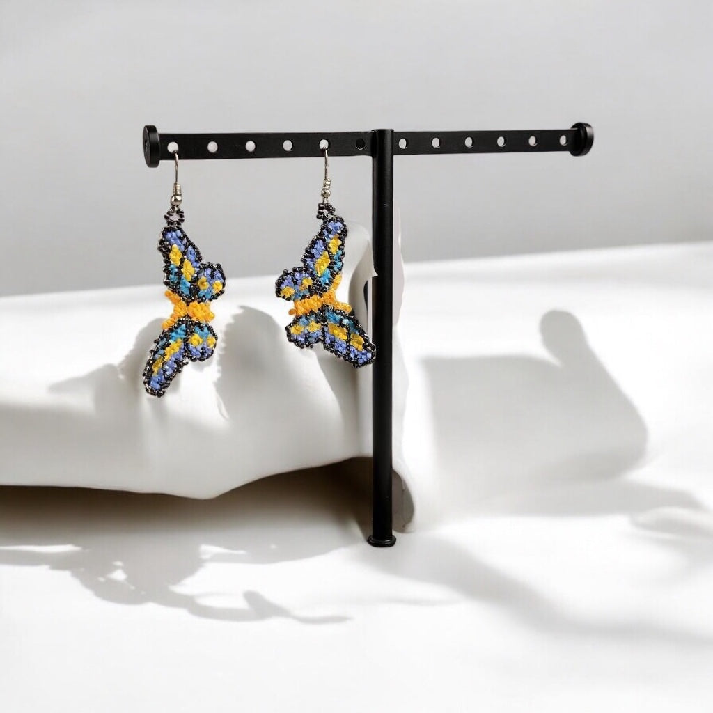 Boucles d'oreilles papillon jaunes perlées