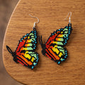 Boucles d'oreilles ailes de papillon bleues perlées
