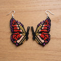 Boucles d'oreilles papillon dorées perlées