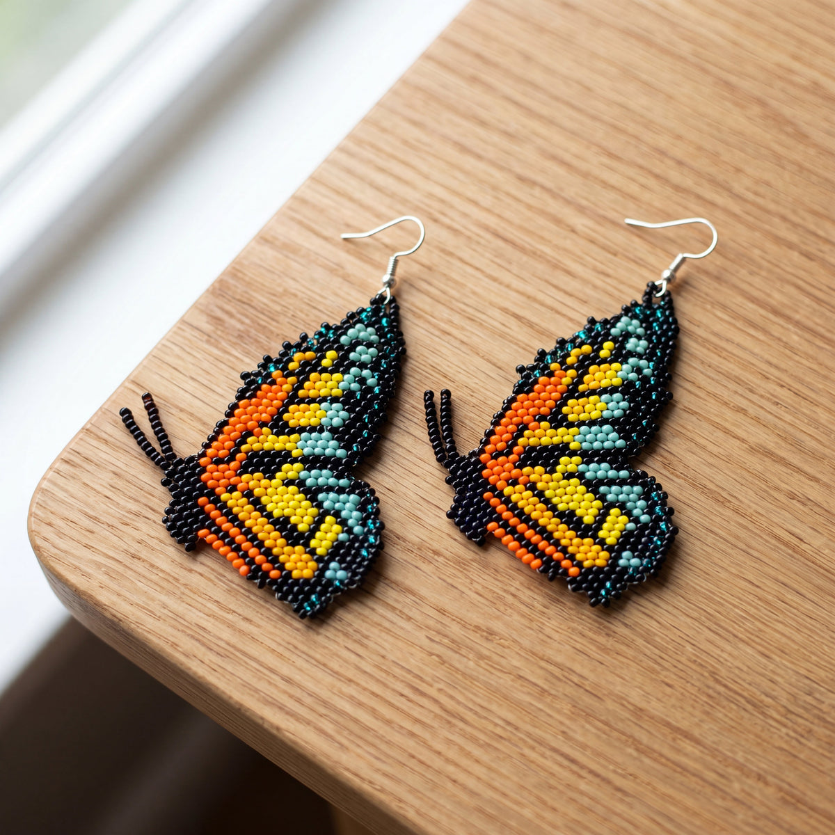 Boucles d'oreilles perlées ailes de papillon turquoise